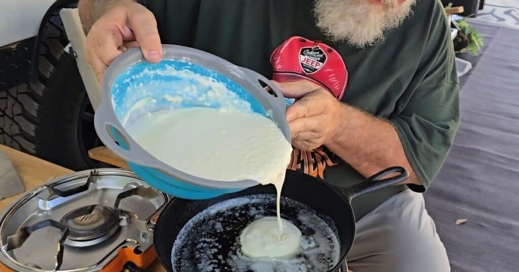 easy blueberry lemon pancakes for camping mornings POURING FLUFFY PANCAKE BATTER