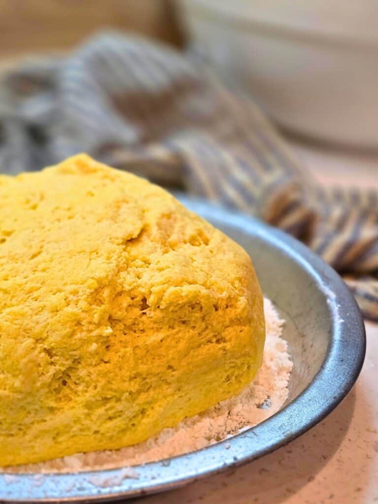 yeast dough rising in mixing bowl