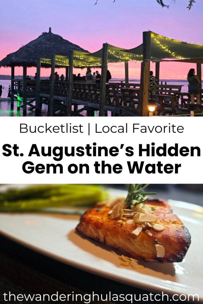 PINTEREST graphic for a travel blog post titled 'St. Augustine’s Hidden Gem on the Water.' The top half features a scenic sunset view of a tiki-style pier restaurant lit with string lights and people enjoying the evening. The bottom half shows a close-up of a perfectly seared piece of fish topped with slivered almonds and garnished with herbs, served with asparagus. Text overlay reads: 'Bucketlist | Local Favorite – St. Augustine’s Hidden Gem on the Water' with thewanderinghulasquatch.com at the bottom.