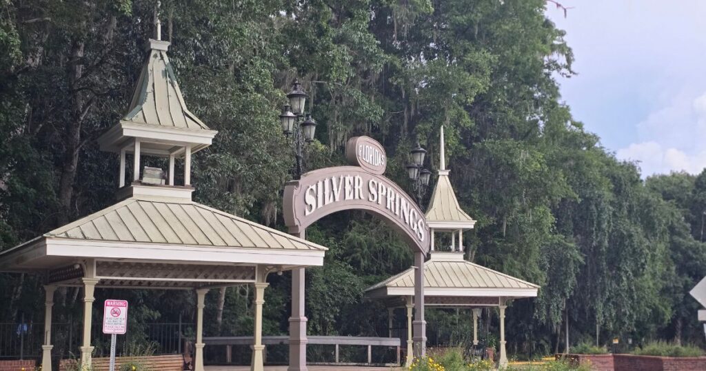 Silver Springs Florida entrance arch in lush green outdoor setting.