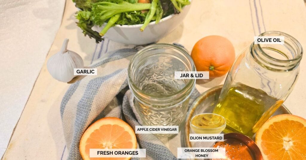 Fresh orange juice, olive oil, apple cider vinegar, honey, Dijon mustard, and garlic for homemade citrus vinaigrette.